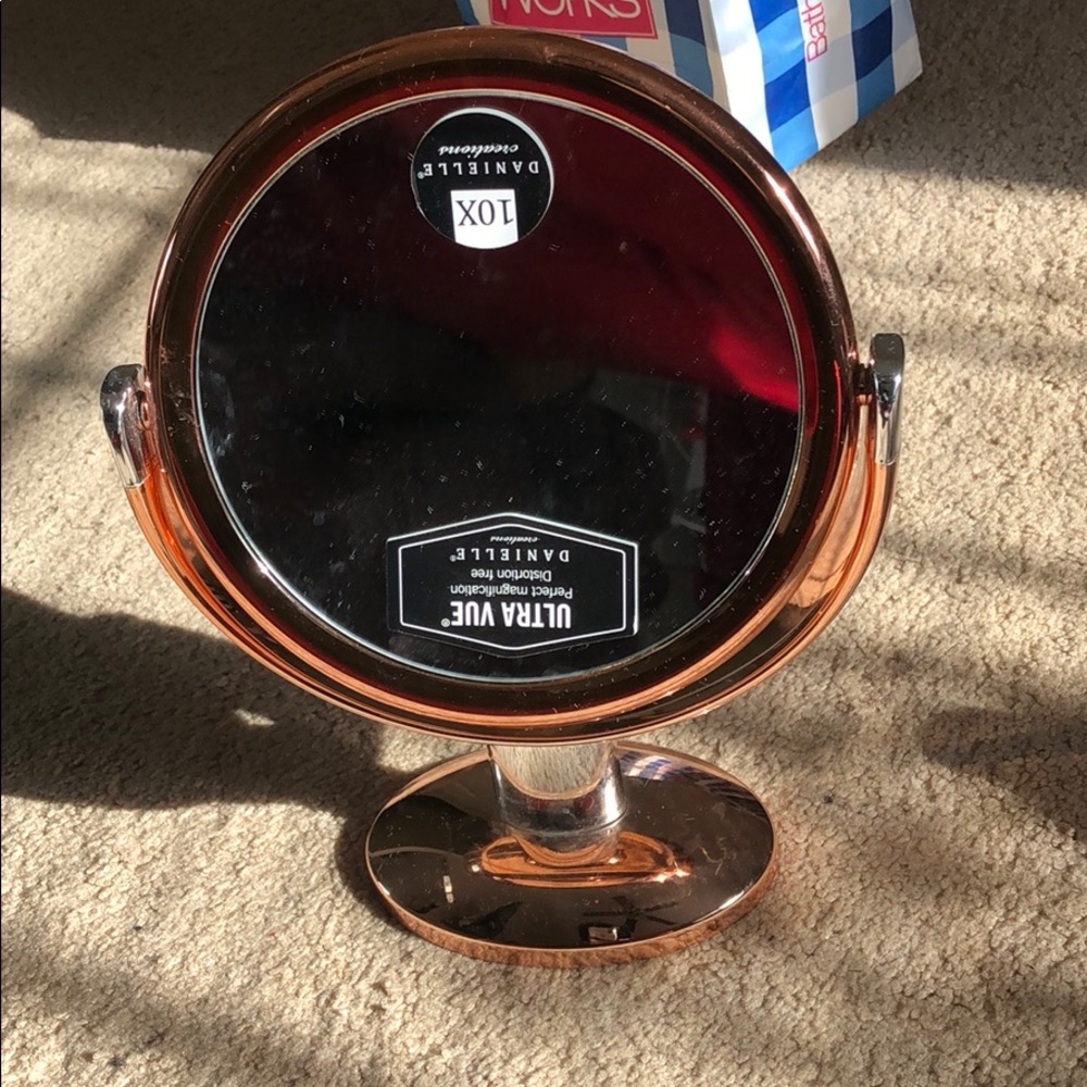 Rose gold mirrored vanity mirror
